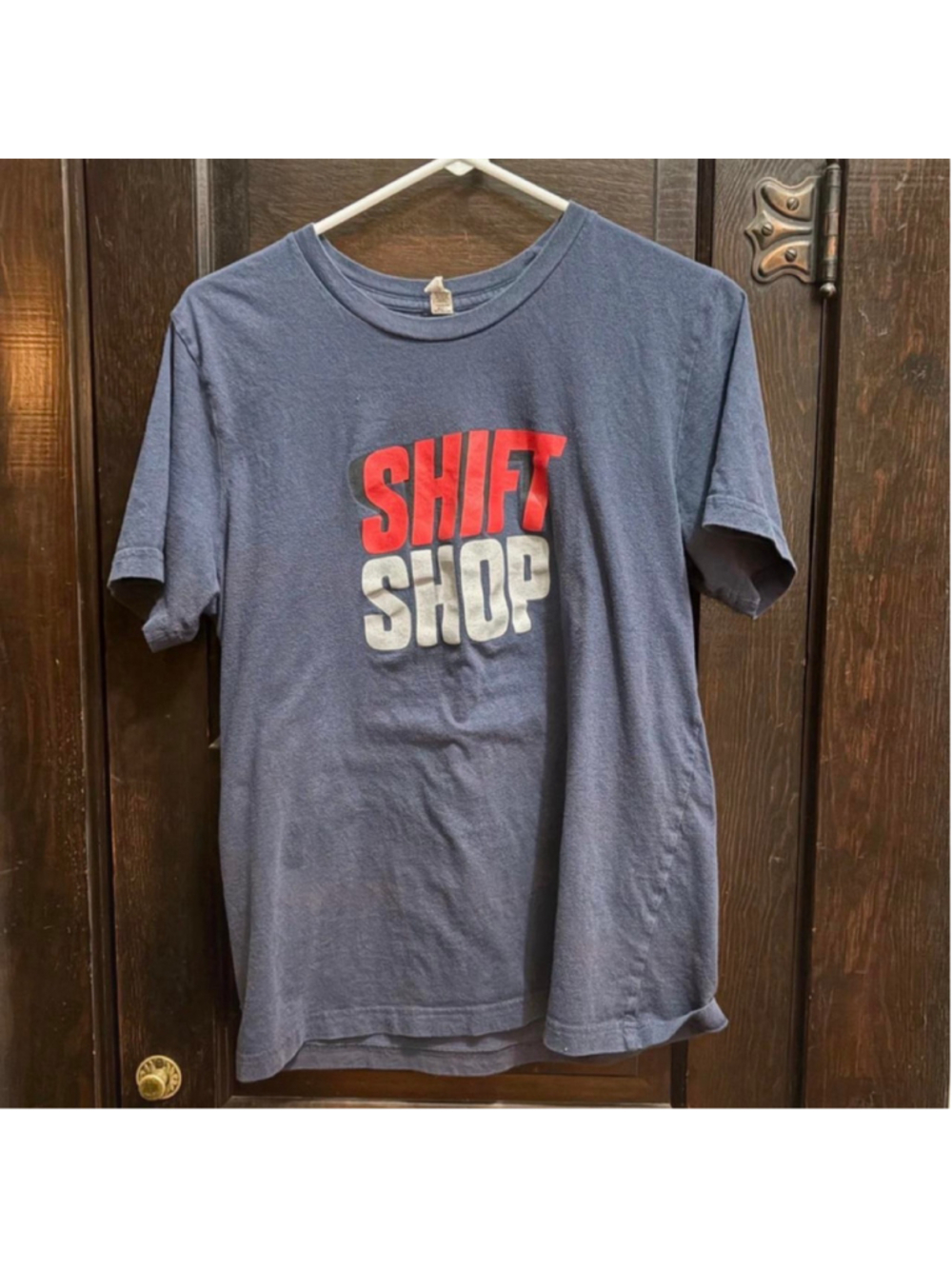 (178) Navy blue cotton t-shirt with red and white 'SHIFT SHOP' graphic, size M #